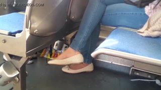 In shoe toe wiggling of asian on bus